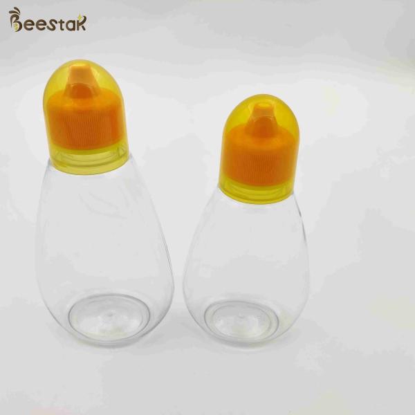 Buy 250ml 350ml 500ml Honey Jar And Spoon Plastic Empty Honey Bottles for honey storage at wholesale prices
