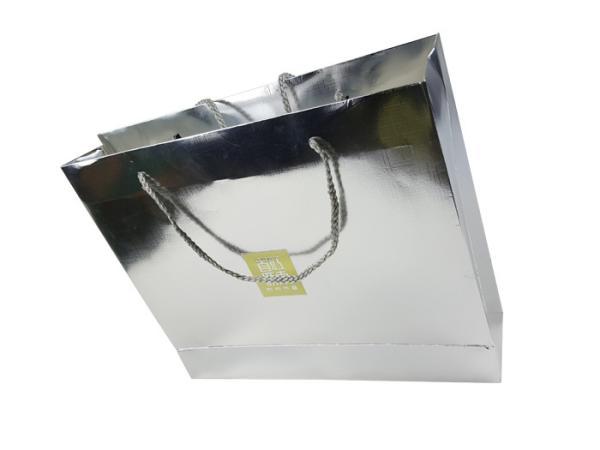 Buy Jinghui Printing Company Silver Color Shinny Craft Lamination Custom Design Paper Bags with Rigid Handle at wholesale prices
