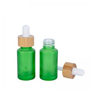 China 30ml Frosted Green Glass Dropper Bottles Essential Oil Bottle With Bamboo Dropper on sale